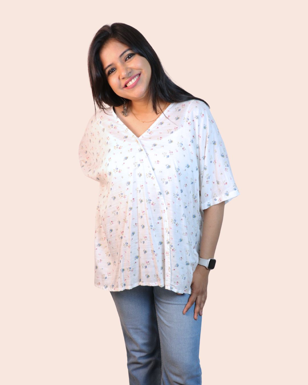 White A-line floral tunic with a relaxed, breezy fit