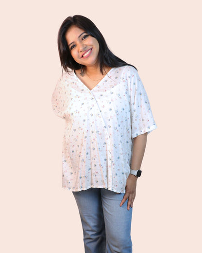White A-line floral tunic with a relaxed, breezy fit