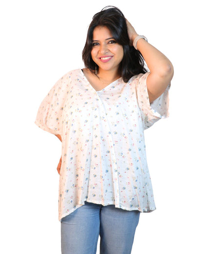 White A-line floral tunic with a relaxed, breezy fit