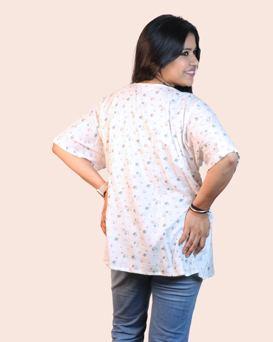 White A-line floral tunic with a relaxed, breezy fit