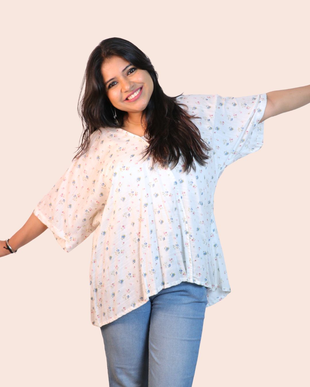 White A-line floral tunic with a relaxed, breezy fit