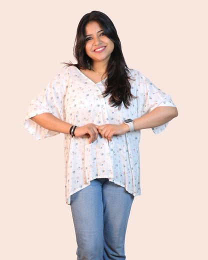 White A-line floral tunic with a relaxed, breezy fit