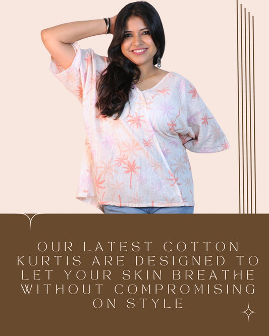 Palm White A-line floral tunic with a relaxed, breezy fit