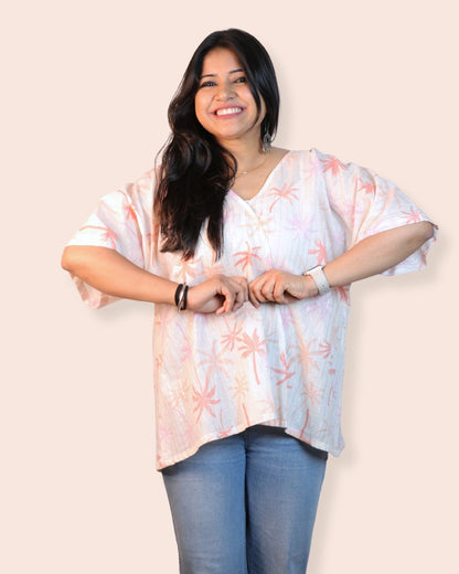 Palm White A-line floral tunic with a relaxed, breezy fit