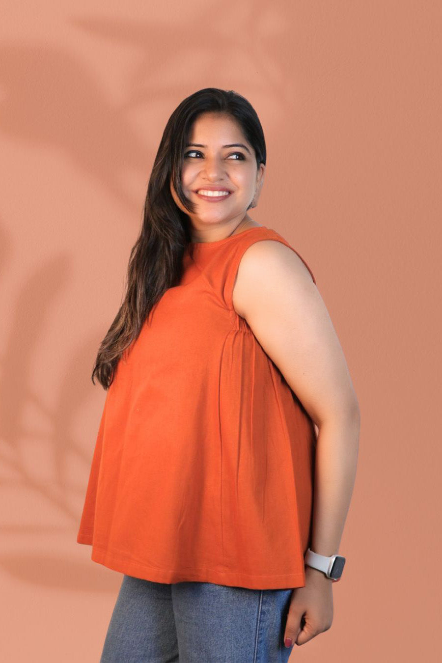 Maavish Orange Sleeveless Top with Side Smocking & Flared Hem