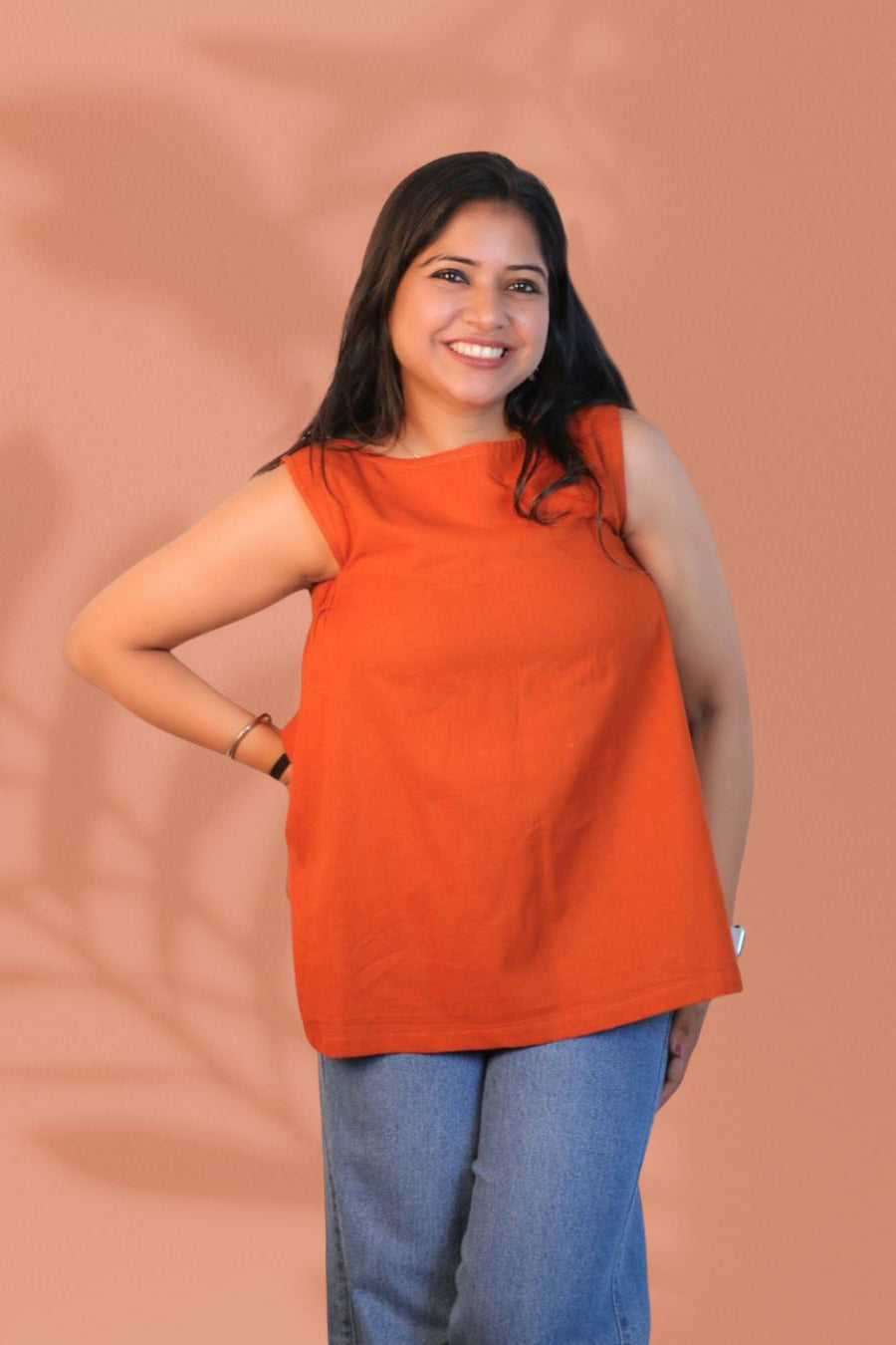Maavish Orange Sleeveless Top with Side Smocking & Flared Hem