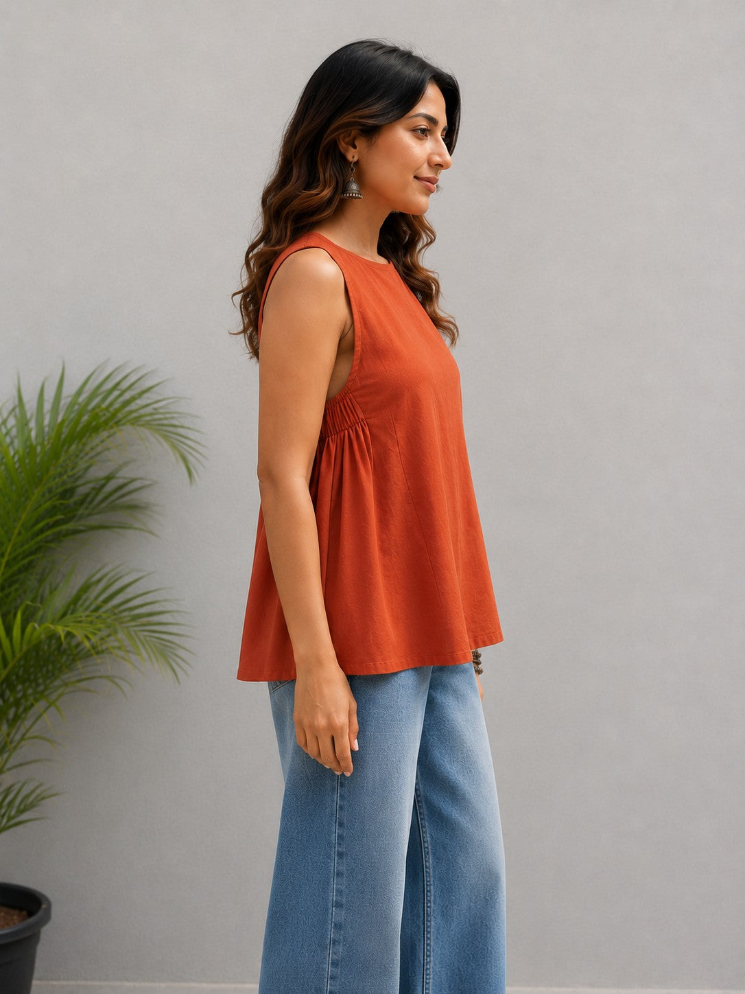 Maavish Orange Sleeveless Top with Side Smocking & Flared Hem